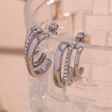 Cercei inox forma C, 3 linii CZ albe 7.6 g